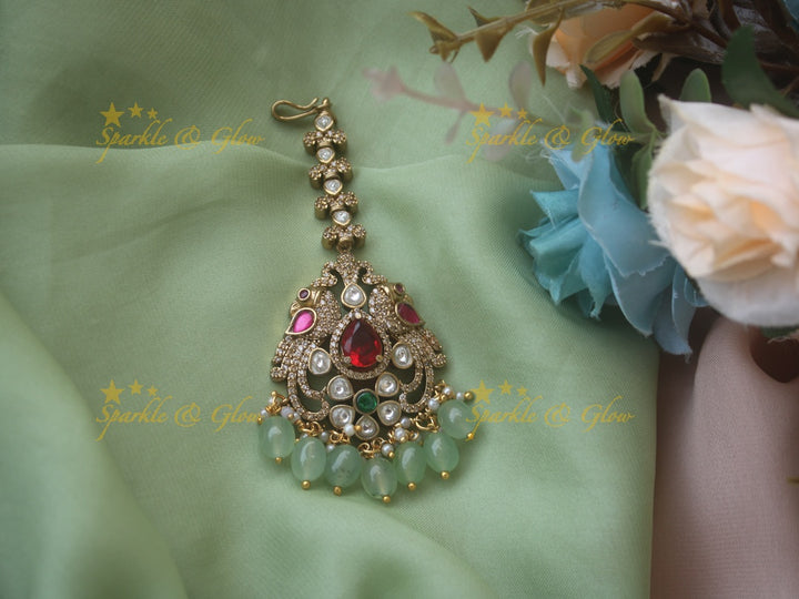 Beautiful peacock design victorian maang tikka with red stone and mint green beads