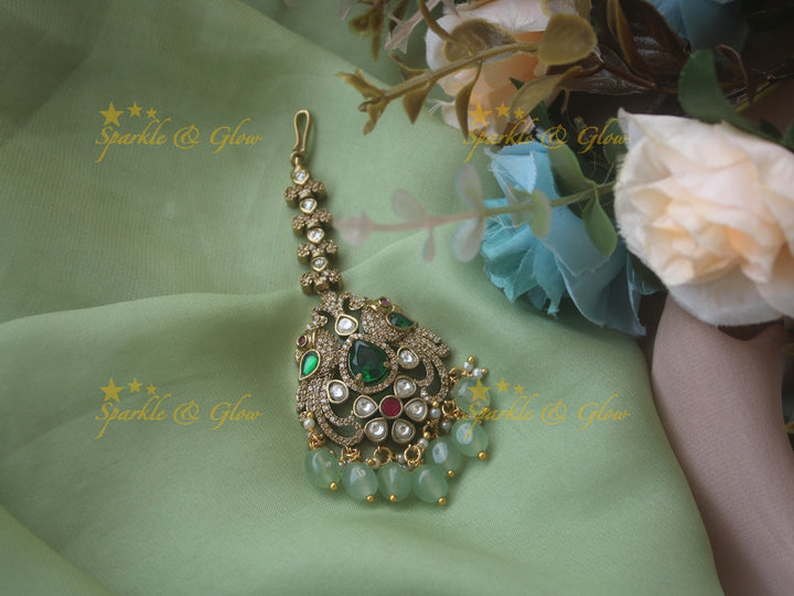Beautiful peacock design victorian maang tikka with red stone and mint green beads