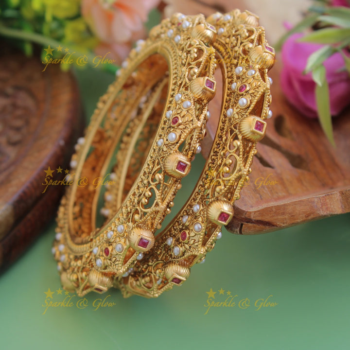 Grand intricate flower and leaf design kadas with ruby and pearls a pair,