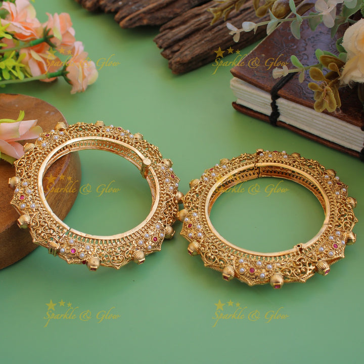 Grand intricate flower and leaf design kadas with ruby and pearls a pair,