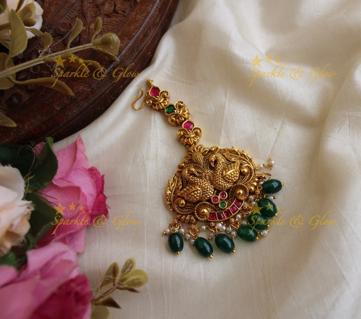 Beautiful peacock carved jadau maang tikka with green beads