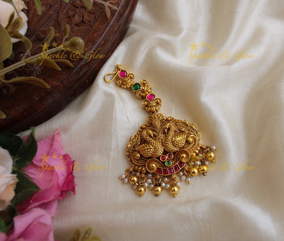 Beautiful peacock carved jadau maang tikka with green beads