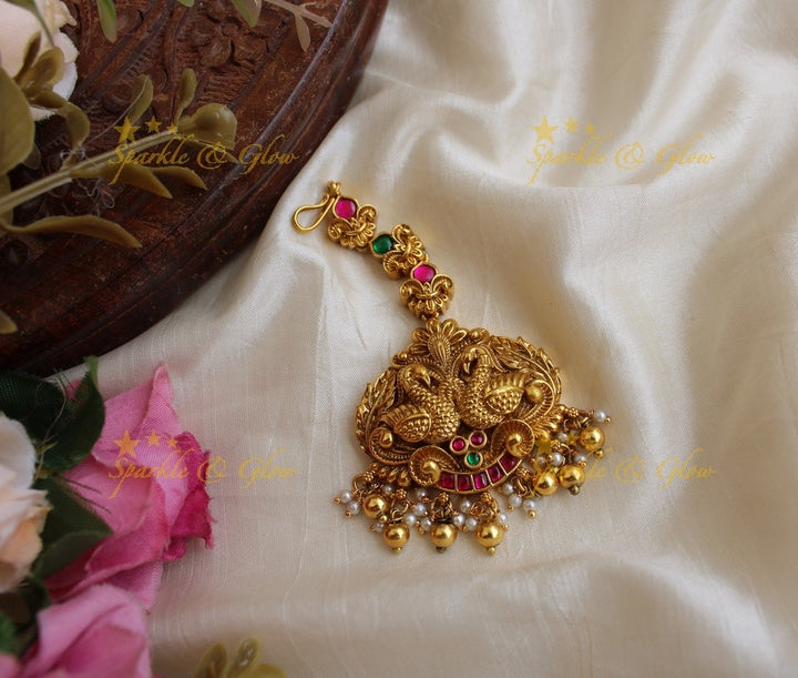 Beautiful peacock carved jadau maang tikka with green beads