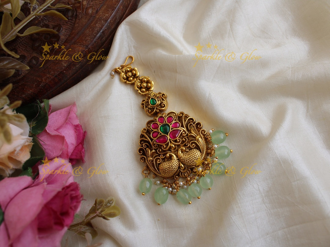 Floral and peacock design jadau maang tikka with mint green beads