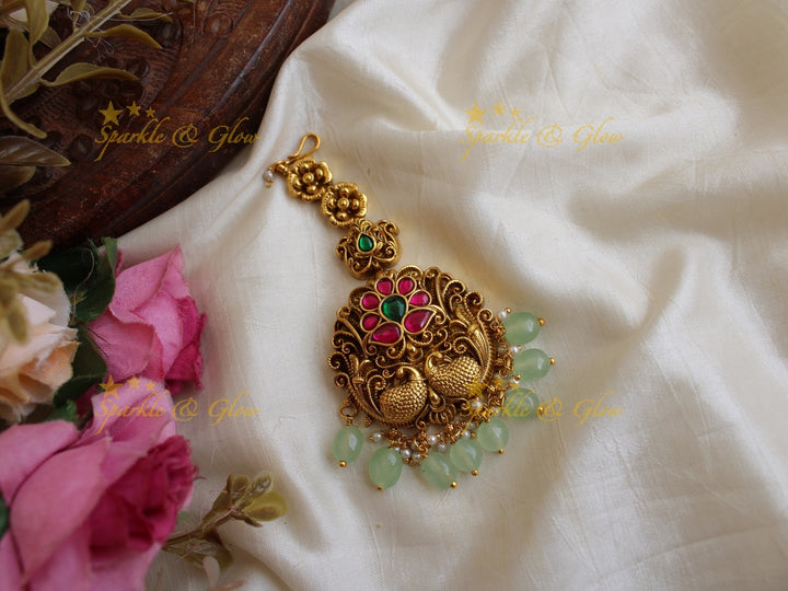 Floral and peacock design jadau maang tikka with mint green beads