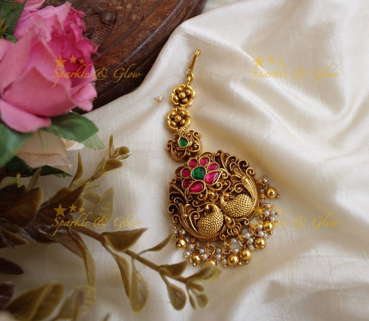 Floral and peacock design jadau maang tikka with mint green beads