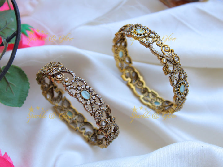 Elegant peacock floral design victorian bangles with green stones a pair, 2.8