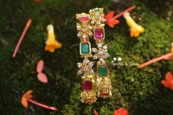 Gold polished snow flake shaped AD stones bangles a pair