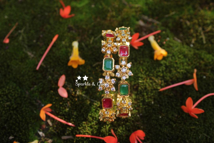Gold polished snow flake shaped AD stones bangles a pair