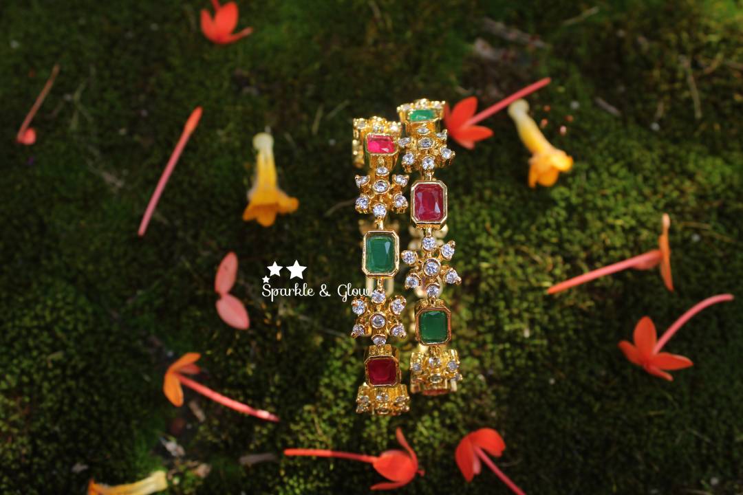 Gold polished snow flake shaped AD stones bangles a pair