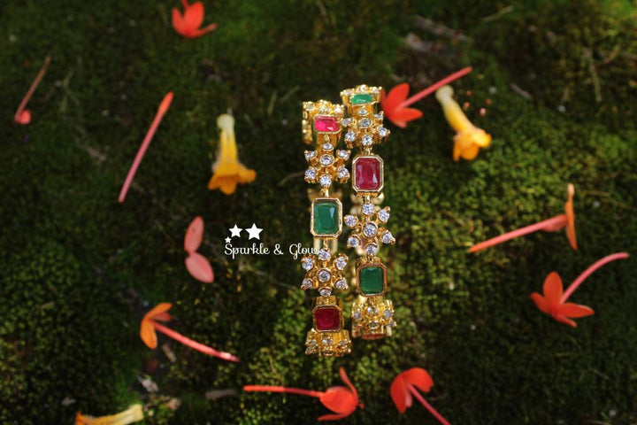 Gold polished snow flake shaped AD stones bangles a pair
