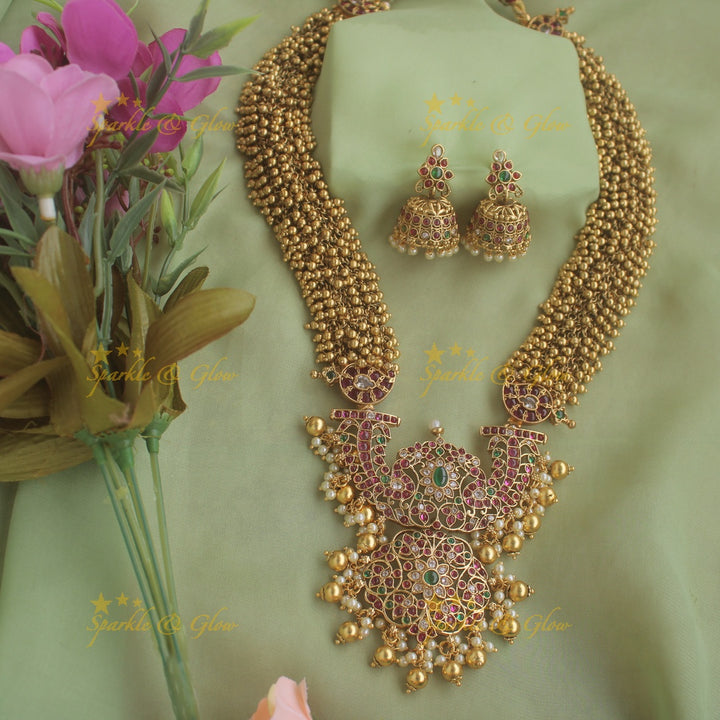 Grand intricate flower pendent gold alike haram with cluster gold beads and multi colour stones