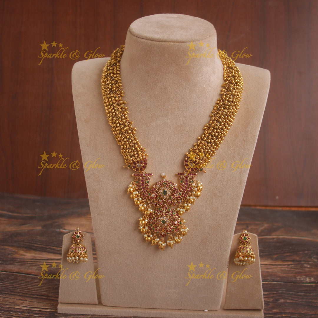 Grand intricate flower pendent gold alike haram with cluster gold beads and multi colour stones