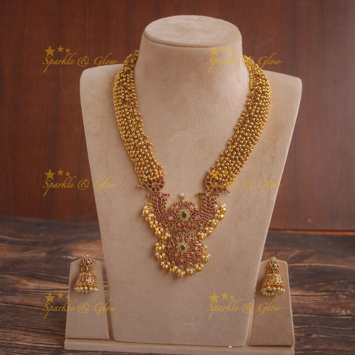Grand intricate flower pendent gold alike haram with cluster gold beads and multi colour stones
