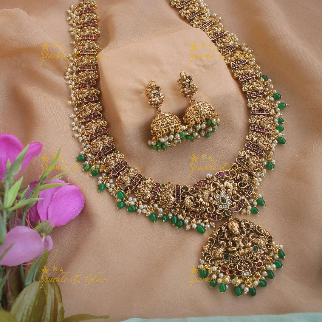 Gorgeous Lakshm peacock carved gutta pusalu long necklace with ruby and green beads