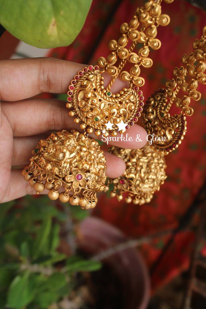 Gold alike polished intricate work lakshmi jhumuaks with ear chain