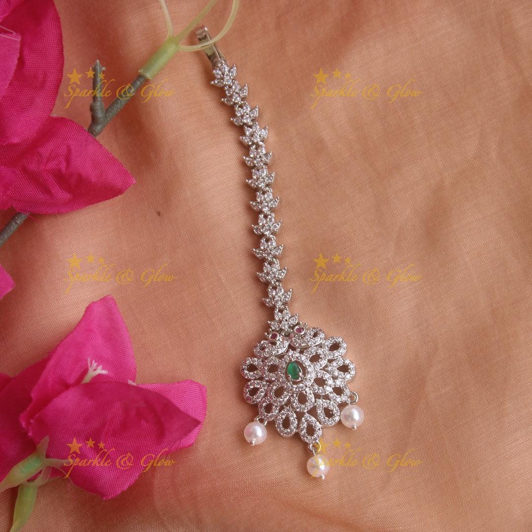 Stunning silver polish peacock water drop maang tikka with pearls and emerald - Sparkle and Glow