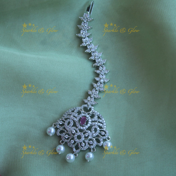 Sparkling silver polish floral maang tikka with pearls and ruby