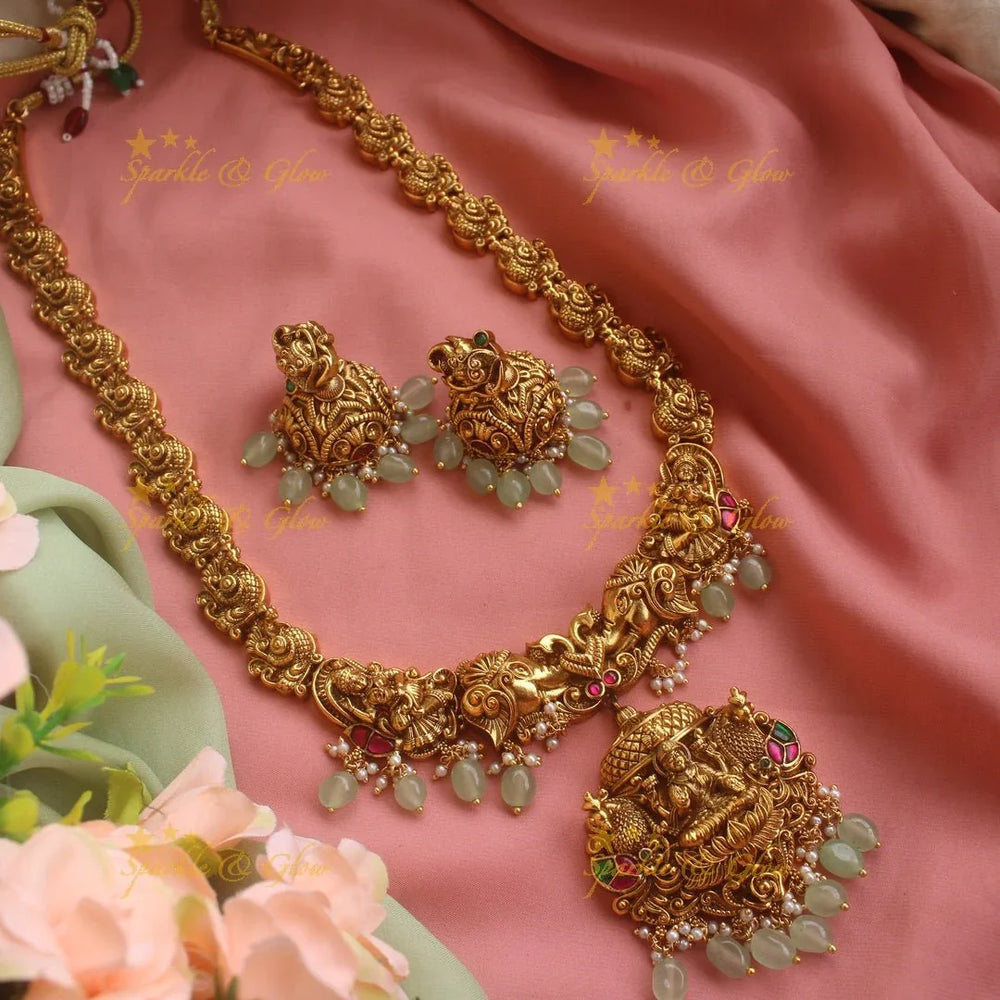 Gorgeous Lakshmi elephant peacock carved Jadau long necklace with mint green beads - Sparkle and Glow