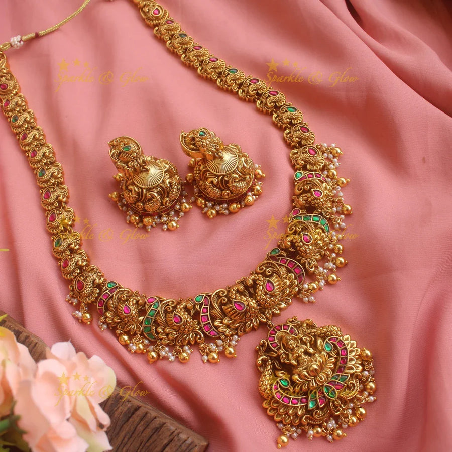 Grand gold alike Lakshmi peacock carved Jadau long necklace with green beads - Sparkle and Glow