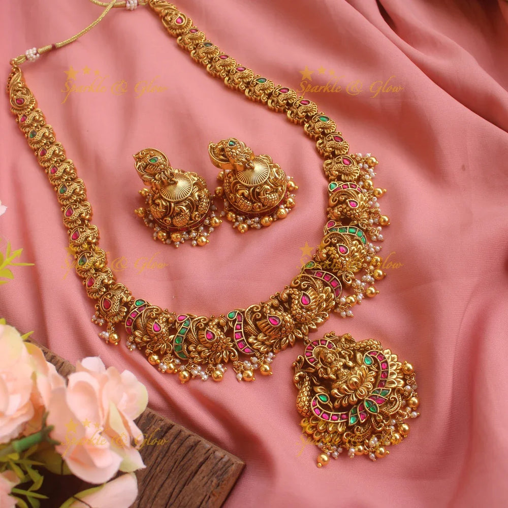 Grand gold alike Lakshmi peacock carved Jadau long necklace with green beads - Sparkle and Glow