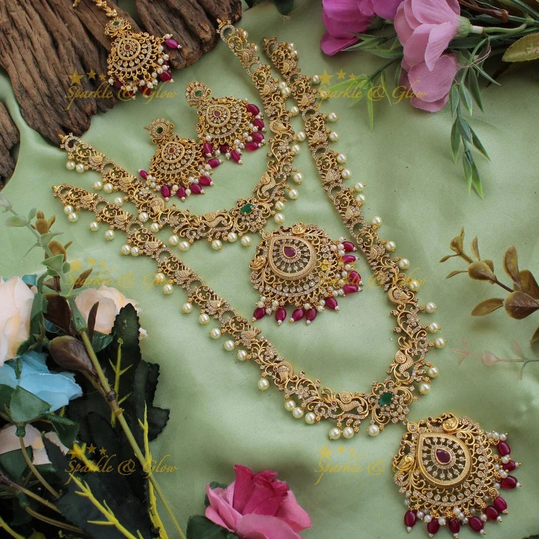 Stunning Premium Matt peacock floral design Necklace set with maang tikka and CZ stones pearls Red beads - Sparkle and Glow