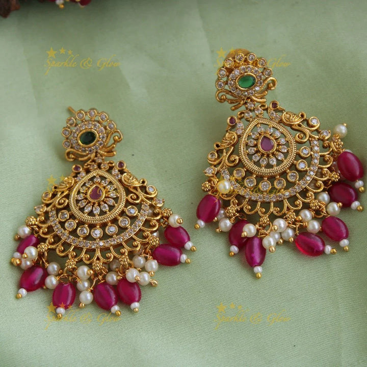 Stunning Premium Matt peacock floral design Necklace set with maang tikka and CZ stones pearls Red beads - Sparkle and Glow