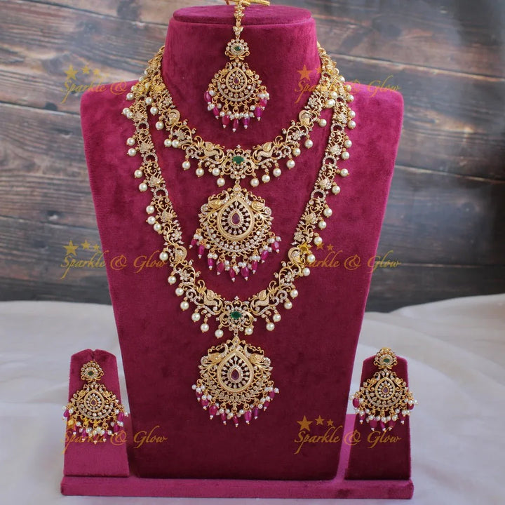 Stunning Premium Matt peacock floral design Necklace set with maang tikka and CZ stones pearls Red beads - Sparkle and Glow