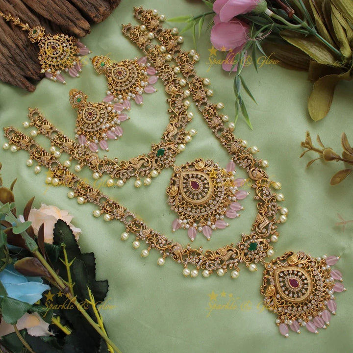 Stunning Premium Matt peacock floral design Necklace set with maang tikka and CZ stones pearls Red beads - Sparkle and Glow