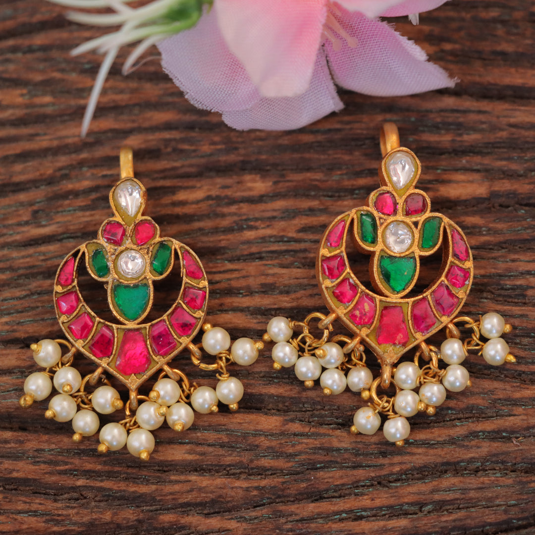 Intricately carved Jadau Kundan Bugadi Earrings with Green-Pink Stones & Kundan Accents